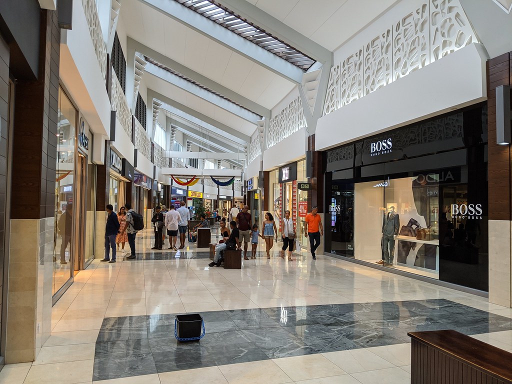 Entrance to Bagatelle Shopping Mall Mauritius with people walking