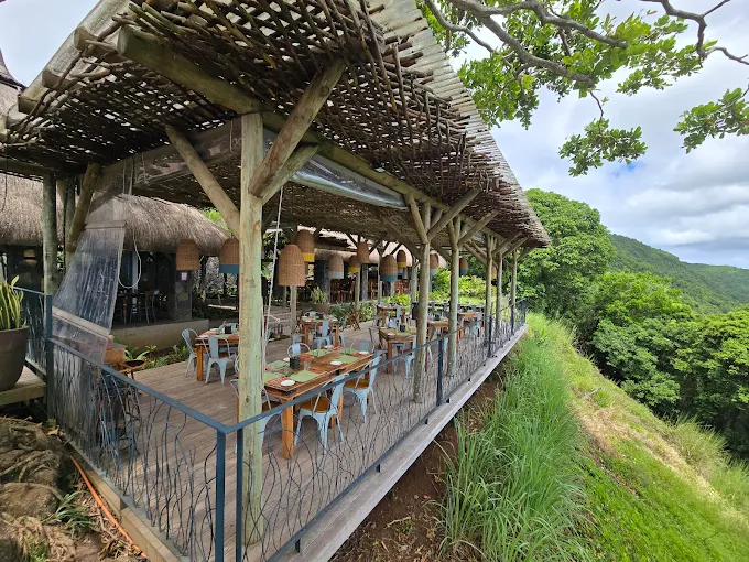 Outdoor terrace of Chamarel Restaurant with panoramic mountain view